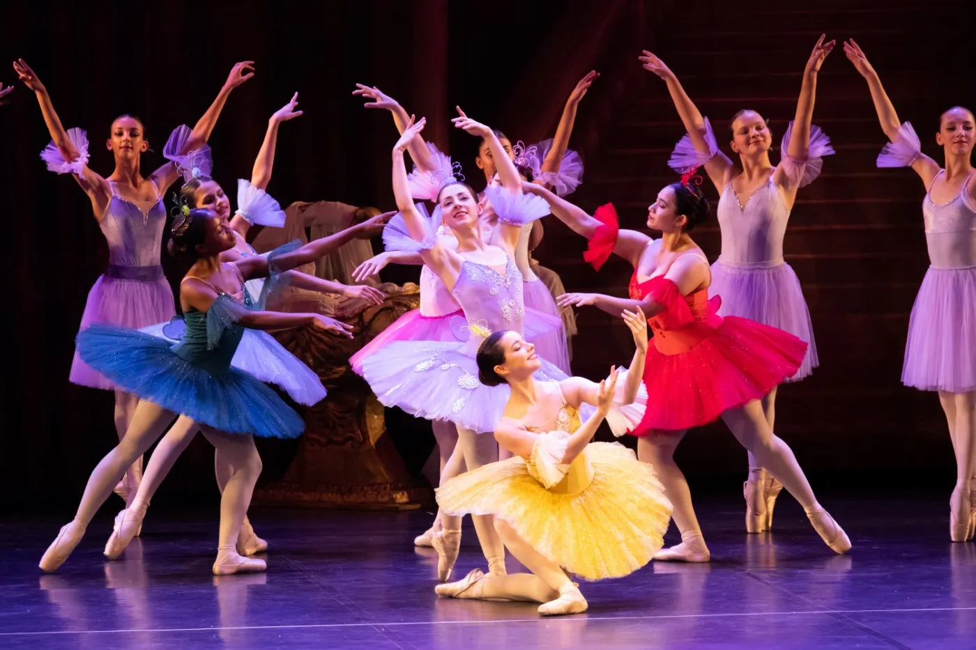 A group photo of ballet dancers in multicoloured tutus taken from YRBC's 2023 performance of The Sleeping Beauty.